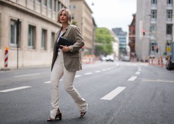 COLOGNE, GERMANY - JUNE 18: Franzi Koenig wearing black Mango heels, beige Zara pants, khaki ARKET blazer, black Chanel leather bag, Chimi eyewear shades and Fafe Collection jewelry on June 18, 2021 in Cologne, Germany. (Photo by Jeremy Moeller/Getty Images)