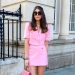 PARIS, FRANCE - MAY 31: Bianca Derhy wears sunglasses, a pink blazer jacket from Zara, a Zara short mini pink skirt, a pink bag from By Far, during an online remote fashion photo session via Apple iphone / Facetime and the CLOS app as the model is based in London - England and the photographer in Paris - France, on May 31, 2021 in Paris, France. (Photo by Edward Berthelot/Getty Images)