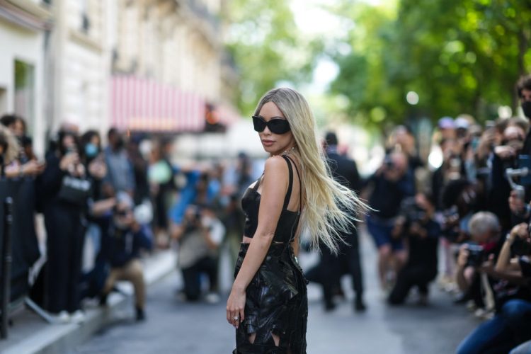 PARIS, FRANCE - JULY 07: Christine Chiu wears sunglasses, a black leather crop top, a black leather midi skirt, outside Balenciaga, during Paris Fashion Week - Haute Couture Fall/Winter 2021/2022, on July 07, 2021 in Paris, France. (Photo by Edward Berthelot/Getty Images)