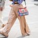 FLORENCE, ITALY - JUNE 14: A guest wearing beige palazzo pants, Dolce Gabbana bag is seen during the 94th Pitti Immagine Uomo on June 14, 2018 in Florence, Italy. (Photo by Christian Vierig/Getty Images)